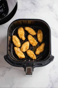 Preheat air fryer to 400°F and arrange coated tenders in basket