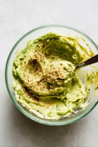 Mash ripe avocado with lime juice, cumin, and smoked paprika until creamy