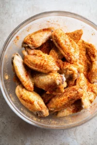 Mix spices with chicken wings