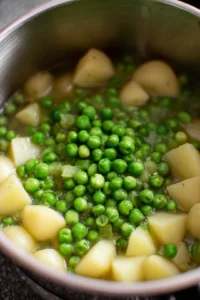 Add peas to the pot and continue cooking for an additional 5 minutes