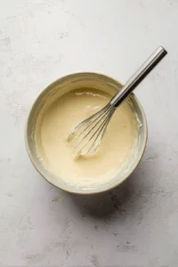 Gradually add water while stirring until you reach your desired consistency.