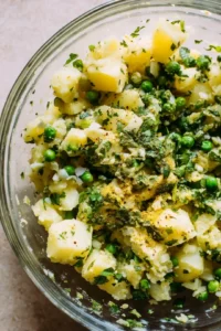 Mix boiled potatoes, peas, spices, and cilantro for the filling