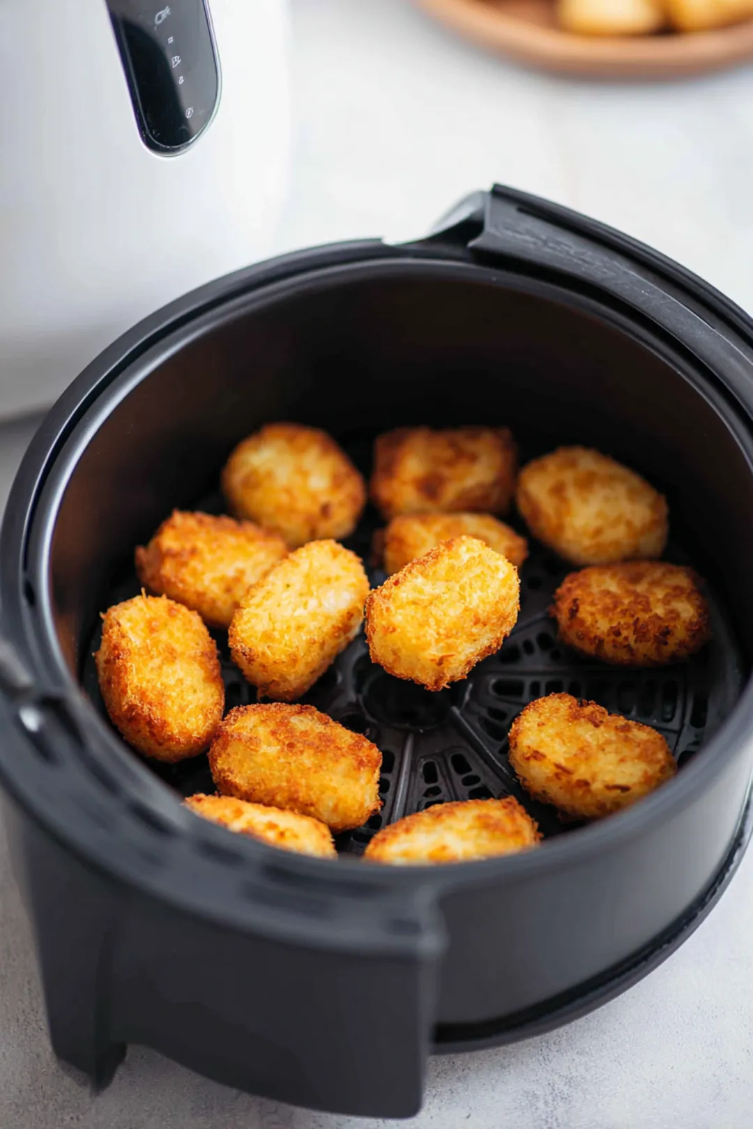 Scoop the batter into small fritter shapes and place them in the air fryer basket