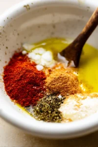 Coat the chicken leg quarters with seasoning rub