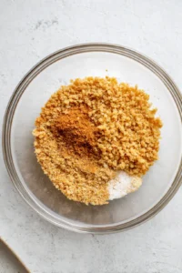 Coat the marinated tofu cubes with nutritional yeast mixture