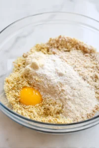 Combine the ground chicken, breadcrumbs, egg, garlic powder, onion powder, salt, and black pepper in a mixing bowl