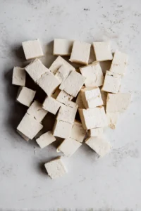 Cut pressed tofu into bite-sized cubes and set aside