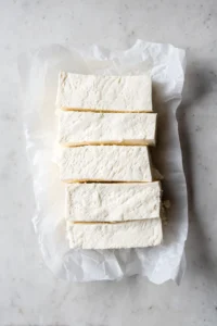 Drain and press firm tofu, then cut into cubes or slices