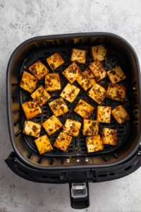 Preheat air fryer to 380 degrees and cook tofu