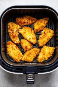 Preheat the air fryer and arrange the chicken tenders