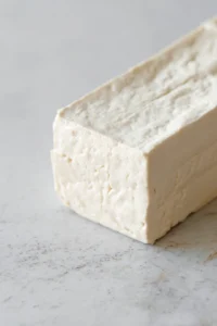 Press tofu to remove excess moisture for crispiness