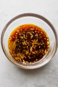 Toss tofu cubes in marinade