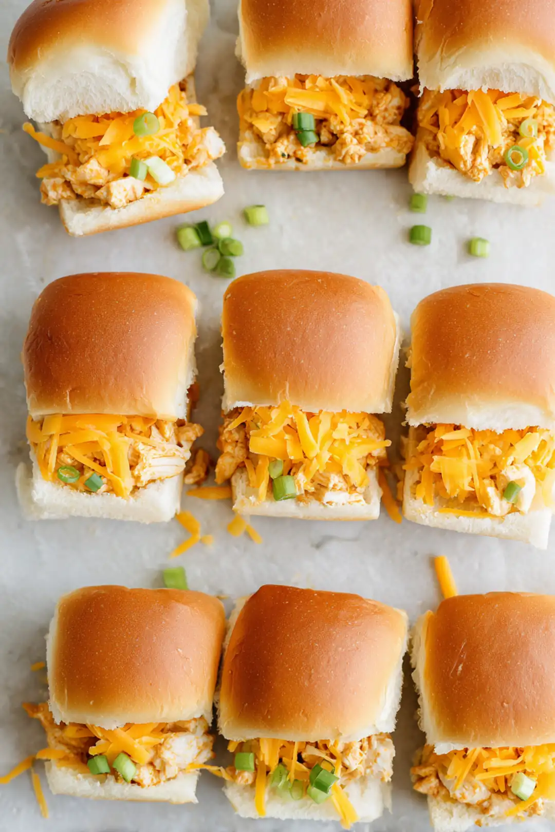 Brush the tops of the rolls with melted butter and bake until golden brown