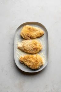 Coat chicken cutlets with seasoned flour, egg, and panko breadcrumbs