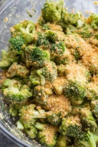 Combine broccoli florets, bread crumbs, cheese, garlic powder, onion powder, and salt in a mixing bowl