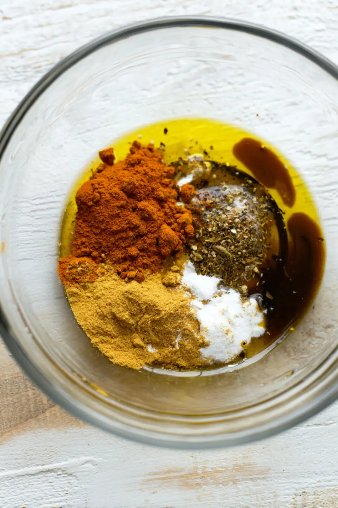 Combine olive oil, soy sauce, garlic powder, and smoked paprika in a bowl to create marinade