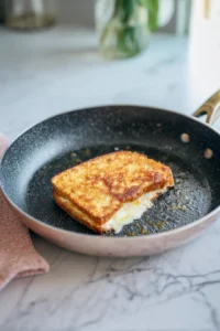 Cook sandwich in the skillet until golden brown and cheese is melted