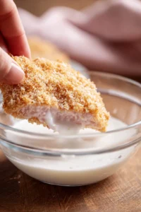 Dip each chicken cutlet into the almond milk and coat with panko breadcrumbs for crispy texture