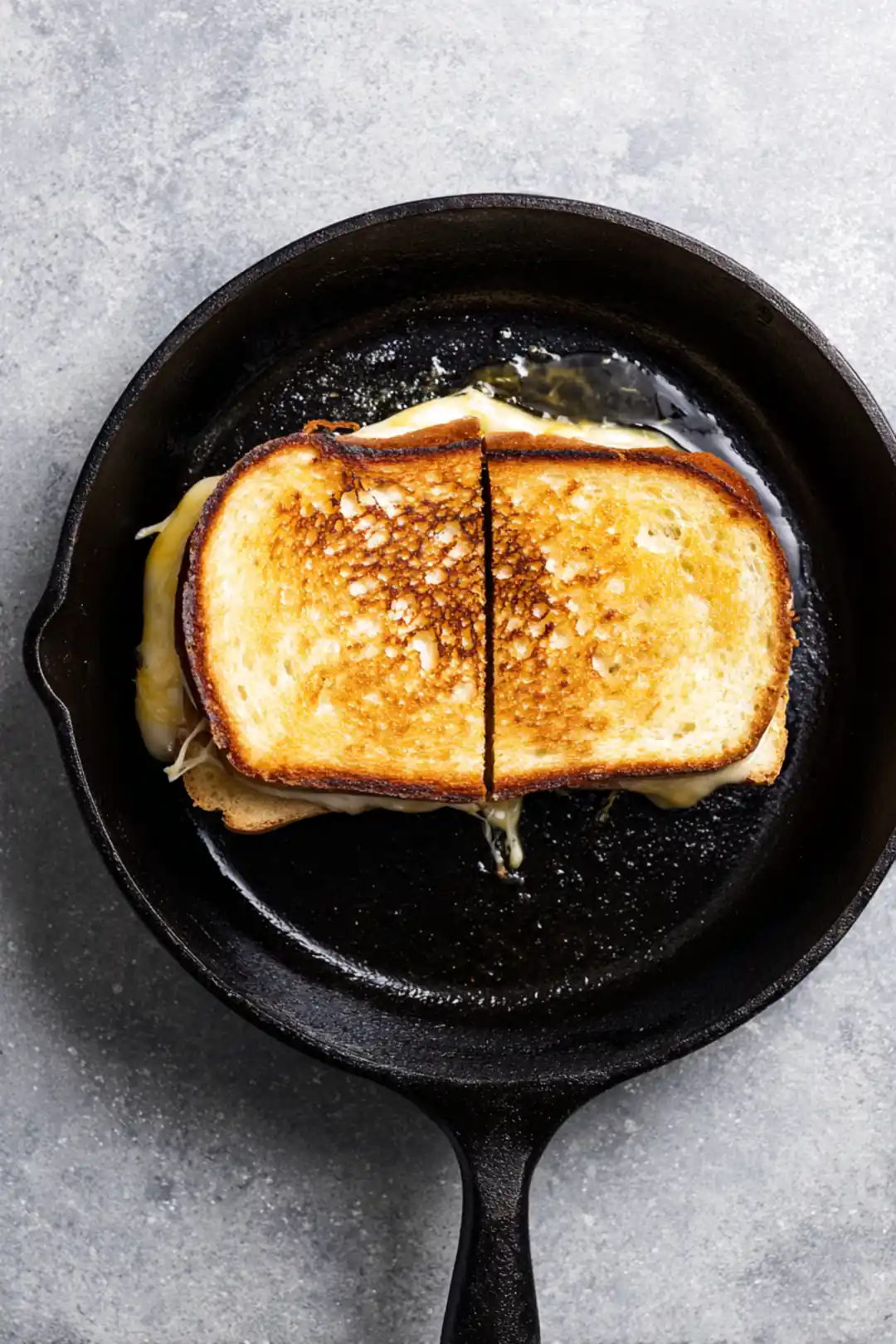 Grill the sandwich until golden brown and cheese is melted