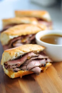 Layer generous amounts of sliced roast beef inside each roll