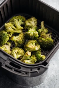 Place seasoned broccoli in air fryer