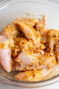 Add chicken breasts to marinade and let sit for 30 minutes
