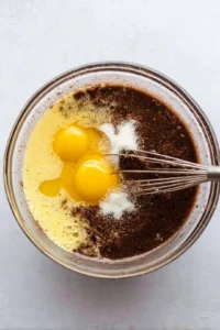 Add in the egg, egg yolk, and sugar to the chocolate mixture
