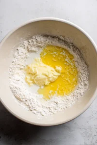 Add milk and melted butter to dry ingredients and stir until combined