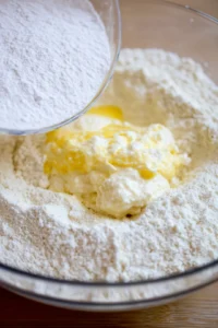 Add mozzarella cheese, cream cheese, and egg to dry ingredients and mix until a dough forms