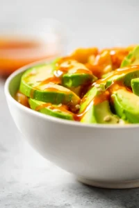Add sliced avocado and drizzle hot honey over the dish
