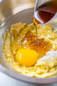 Add vanilla extract and egg yolk then mix thoroughly until smooth