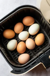 Arrange eggs in air fryer basket without touching
