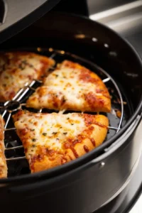 Arrange pizza slices in air fryer
