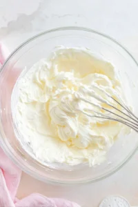 Beat the cream cheese until smooth and add sugar and vanilla extract