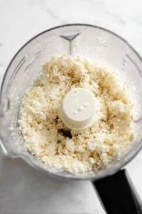 Blend soaked almonds until smooth and mix in lemon juice and salt