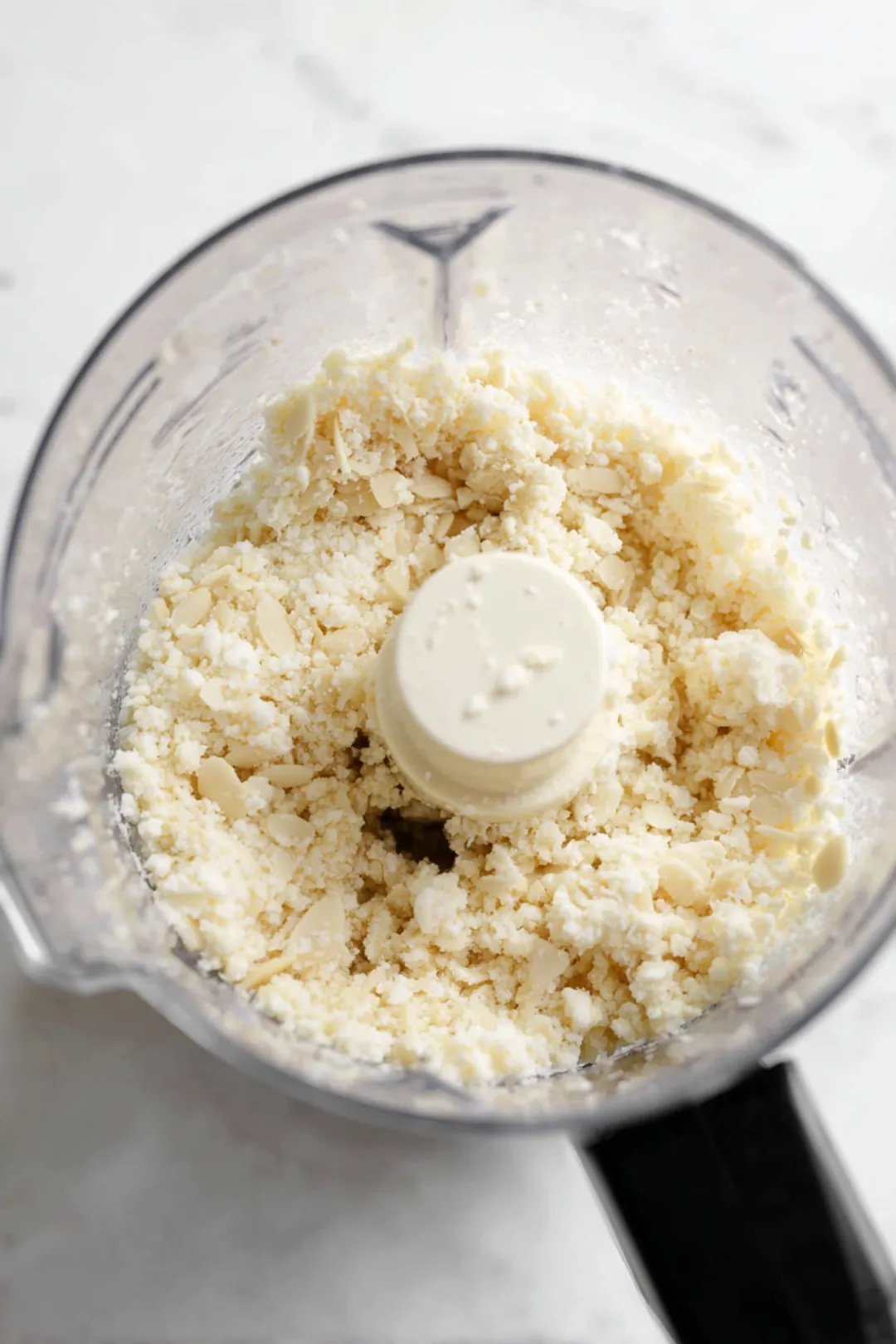 Blend soaked almonds until smooth and mix in lemon juice and salt