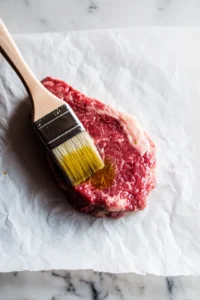 Brush leftover steak with olive oil to retain moisture and flavor