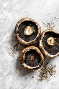 Brush the portobello mushrooms with olive oil and season with salt and pepper.
