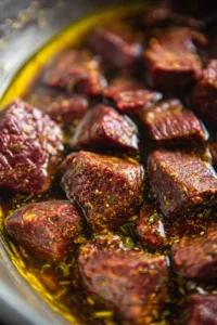 Coat beef chunks in marinade and refrigerate