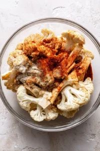 Coat cauliflower steaks with olive oil and spices