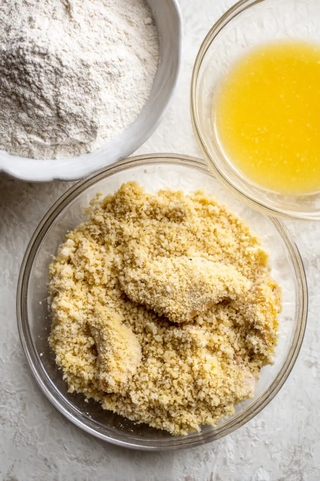Coat chicken tenders with flour, egg, and panko breadcrumbs