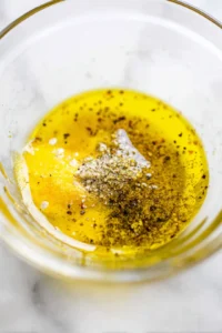 Coat the salmon fillets with the olive oil mixture