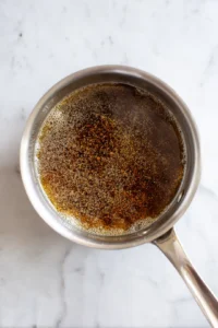 Combine beef broth, soy sauce, and Worcestershire sauce in a saucepan