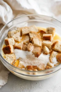 Combine bread, milk, sugar, eggs, vanilla, and cinnamon in a bowl