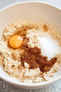 Combine coconut sugar, vanilla extract, and egg with dry ingredients and mix well.