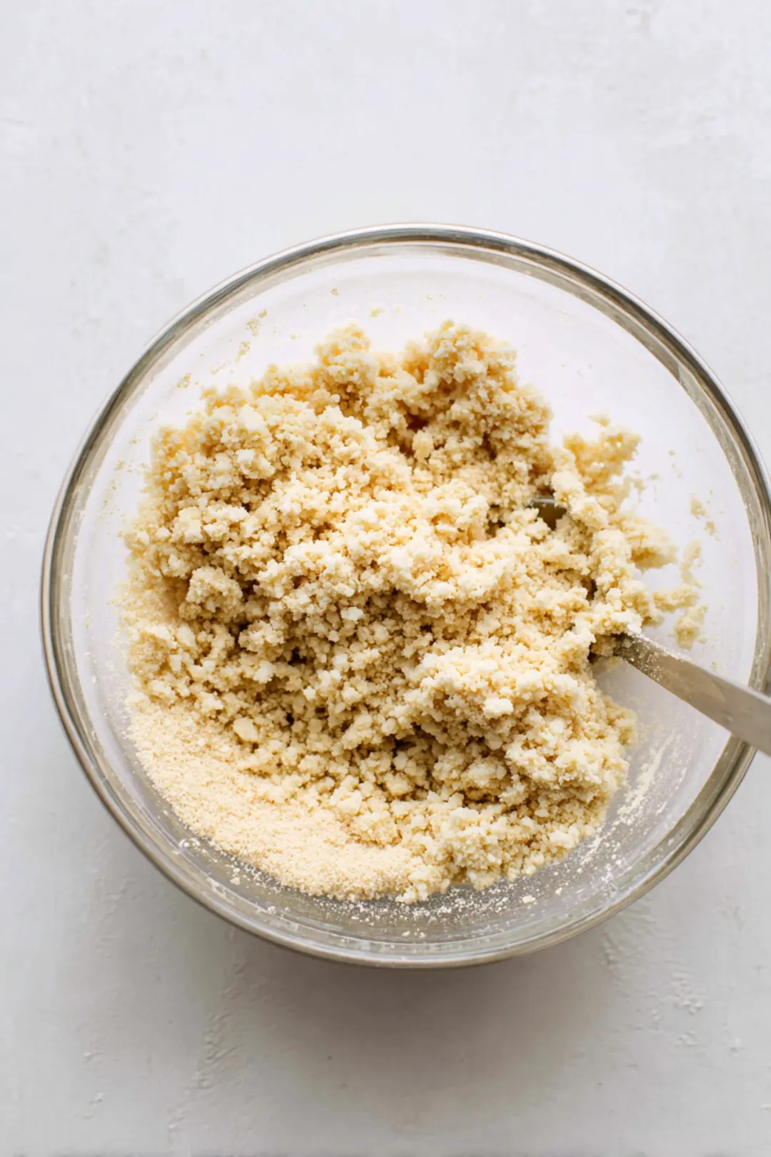 Combine crumbled tofu with nutritional yeast and lime juice in a bowl