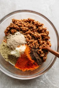 Combine ground turkey with taco seasoning in a large mixing bowl