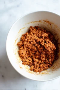 Combine ground turkey with taco seasoning in a mixing bowl
