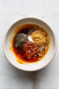 Combine honey, chipotle in adobo sauce, garlic powder, and onion powder to create the marinade