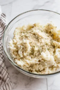 Combine leftover turkey and mashed potatoes.